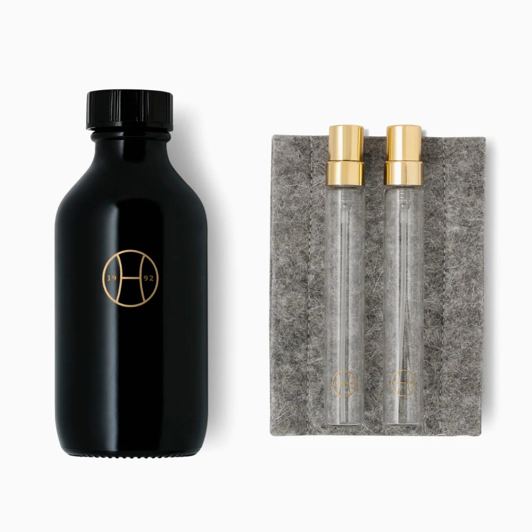 CLAY 100ml with two refillable travel sprays and a felt pouch