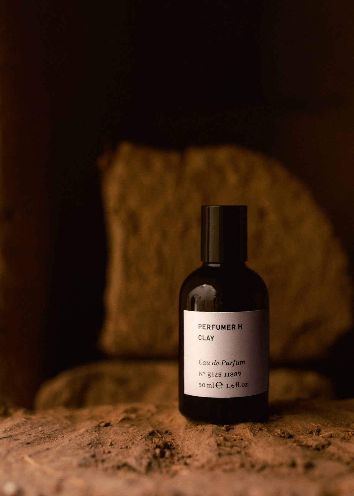 CLAY eau de parfum 50ml on a clay ledge