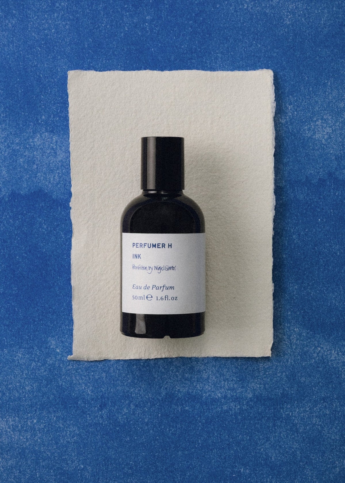 Ink Rewritten by Nigel Slater on paper over blue ink