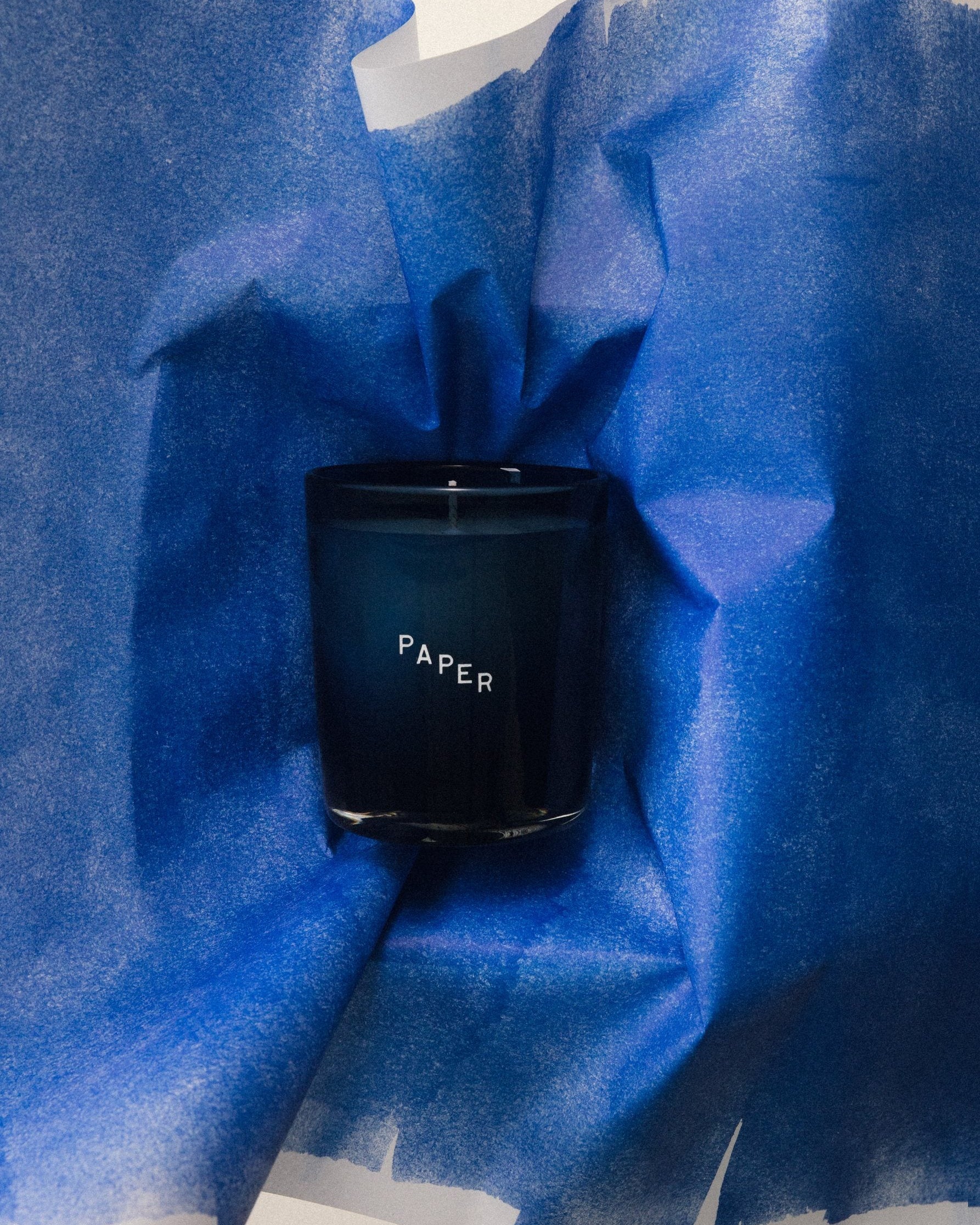 Ink on Paper: Paper candle in blue tissue