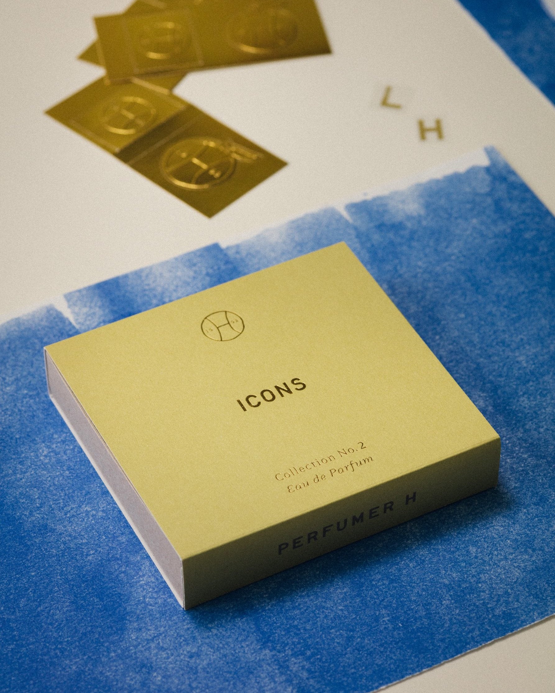Ink on Paper: Icons box on blue paper