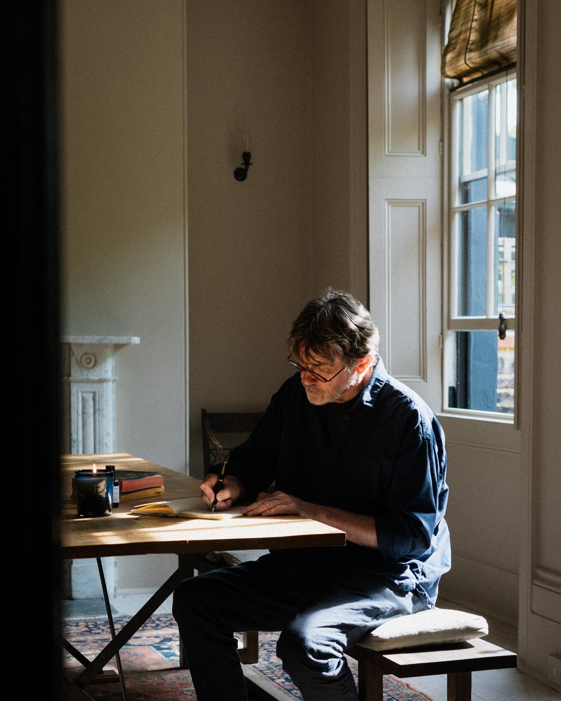 Nigel Slater writing at his desk