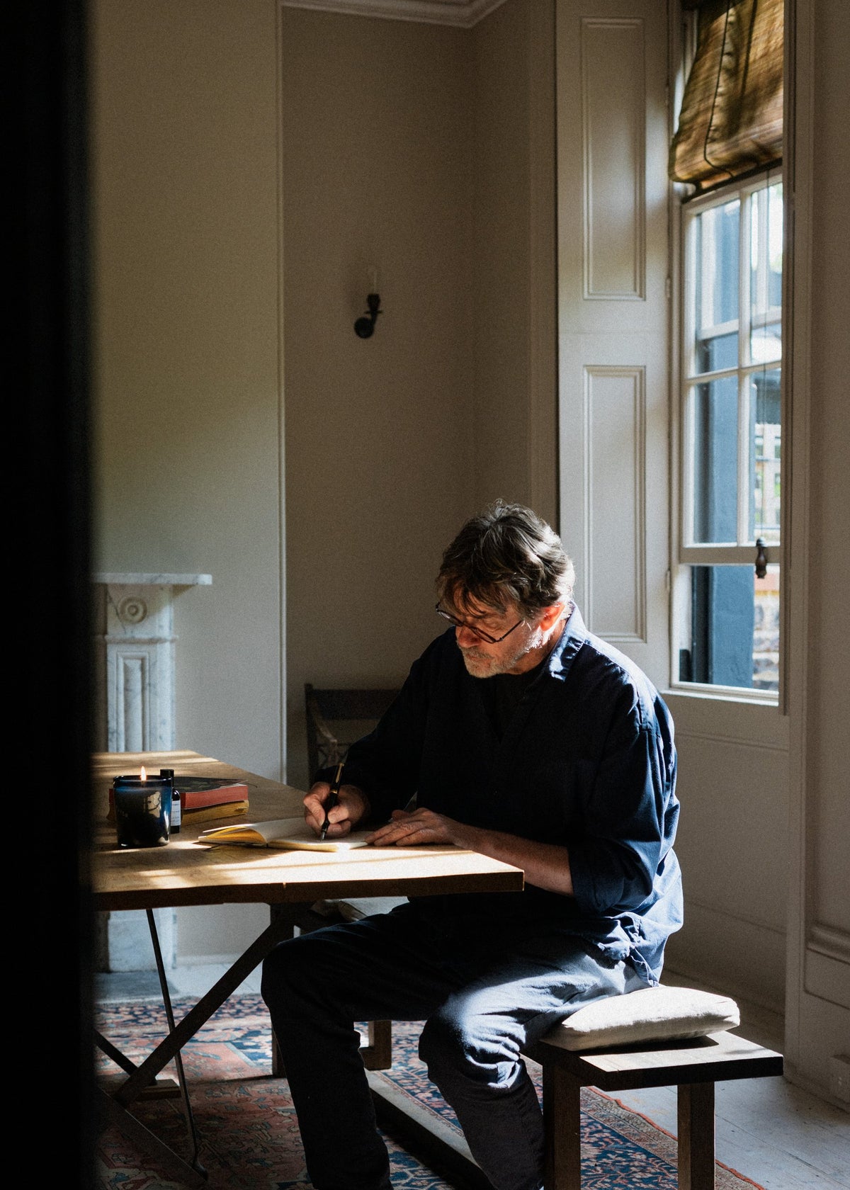 Nigel Slater writing at his desk